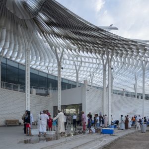 The new market celebrates the continuity of the region’s trade and fishing traditions, while also catering to Oman’s growing tourism industry.  Muttrah’s top tourist attraction, it houses a rooftop restaurant in addition to the market itself.  The design exemplifies contextual regionalism, respecting the scale and integrity of the traditional context whilst adding new and dynamic elements.  The curved wall that defines its spine reflects the radial shape of the corniche and bay area, and has light-filtering pierced decoration.  The canopy’s form is inspired by the sinuous flow of Arabic calligraphy and exploits the play of light and shadow. Its aluminium fins provide shade, natural ventilation and an ephemeral appearance that contrasts with the simple solidity of the concrete structure below.